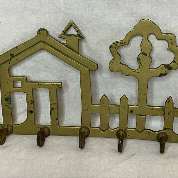 Vintage solid brass wall key holder. Design is of a home, picket fence and tree. - Picture 1 of 9